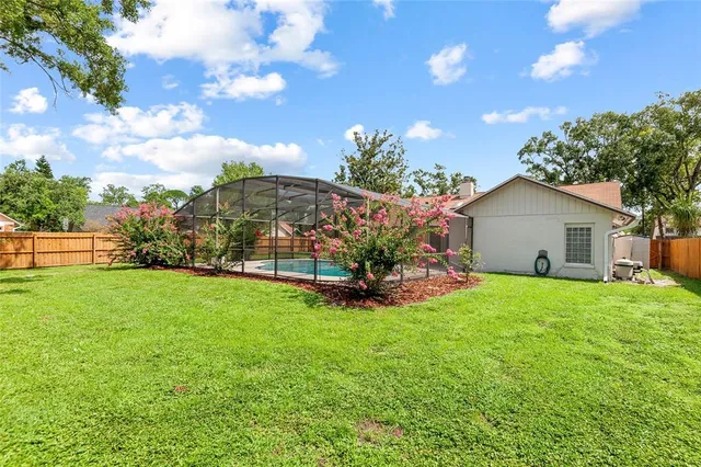 a view of backyard with garden and entertaining space