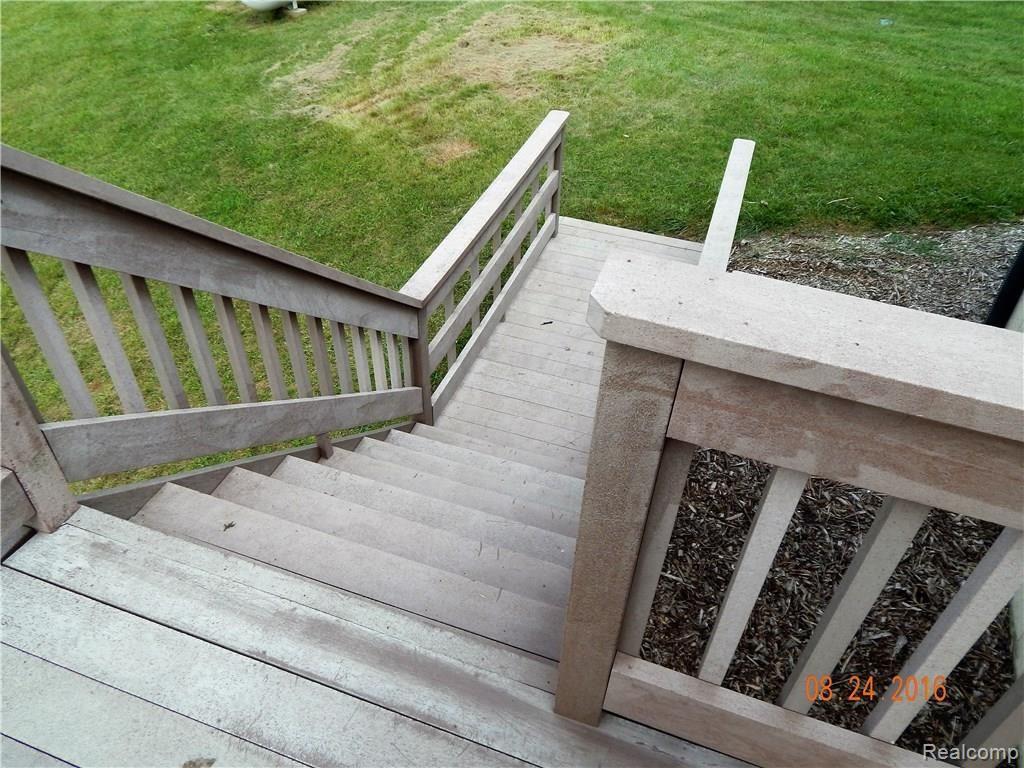 9792 Judd Road Fowlerville, MI 48836 - Photo 15 of 21 Steps down from Deck