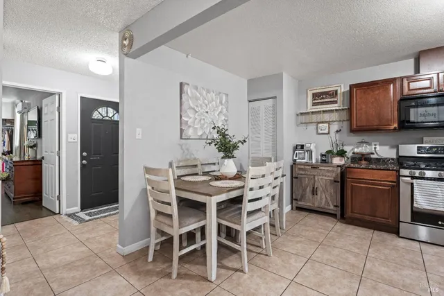 a kitchen with stainless steel appliances kitchen island granite countertop a sink and cabinets