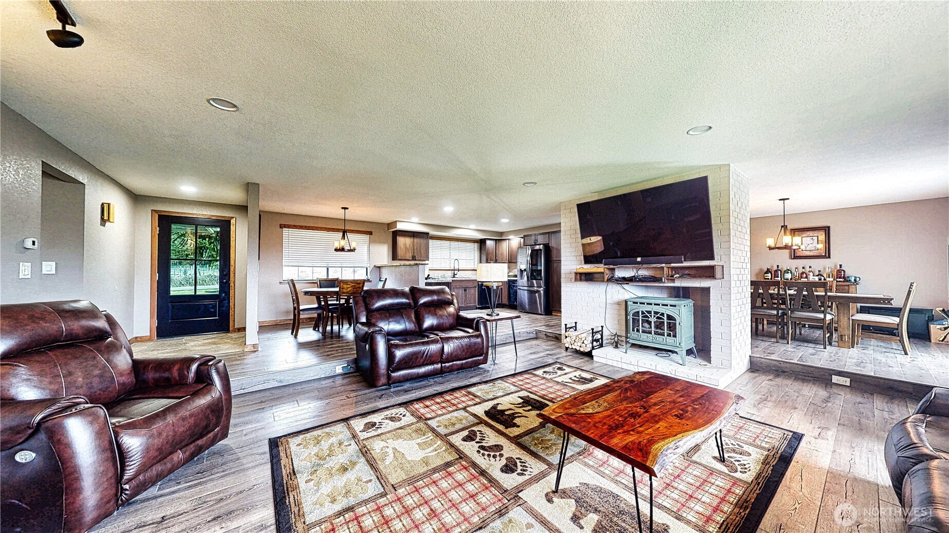 22128 Bulson Road Mount Vernon, WA 98274 - Photo 19 of 39 a living room with furniture and a flat screen tv