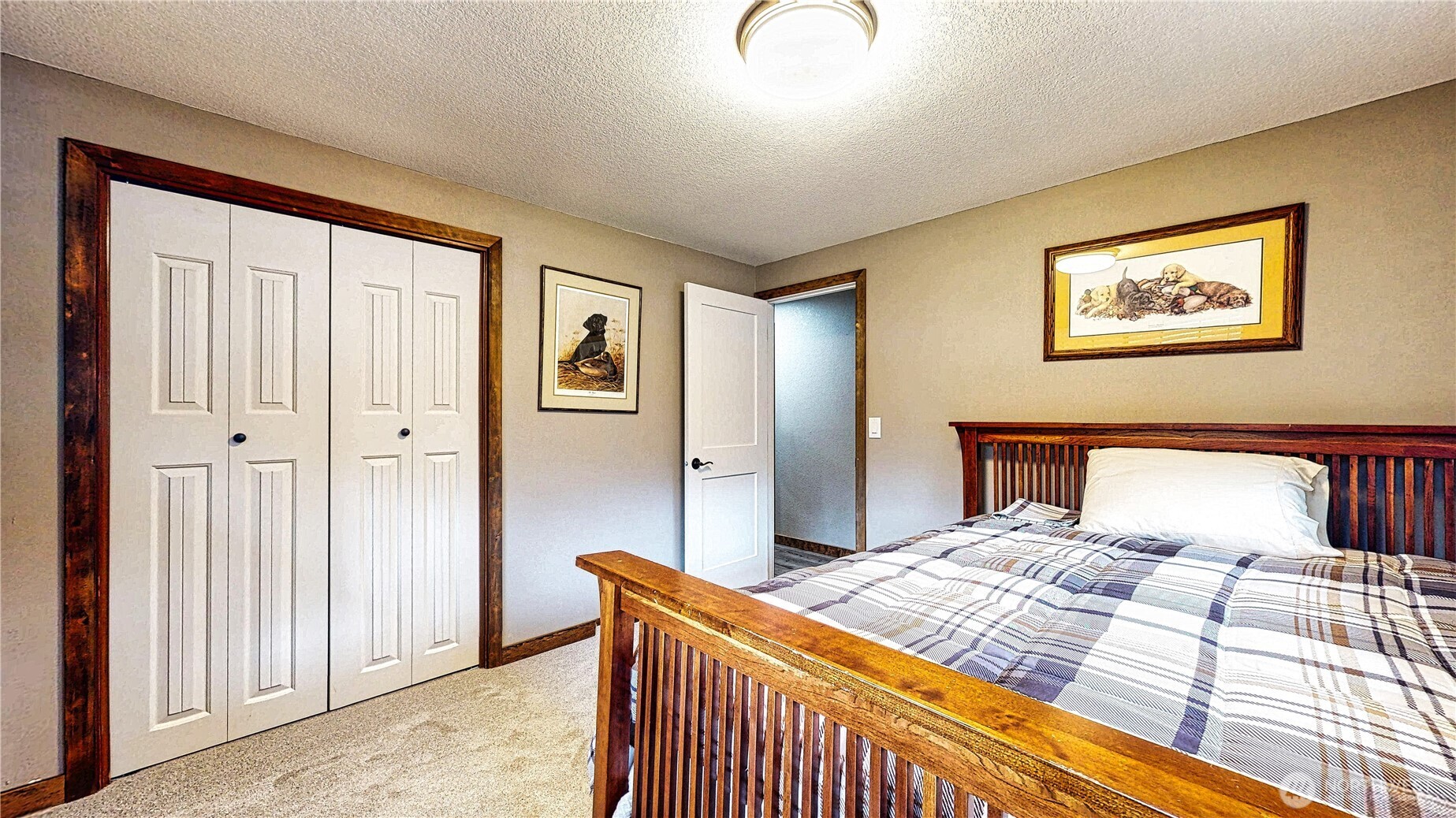 22128 Bulson Road Mount Vernon, WA 98274 - Photo 23 of 39 a bedroom with a bed and a painting on the wall