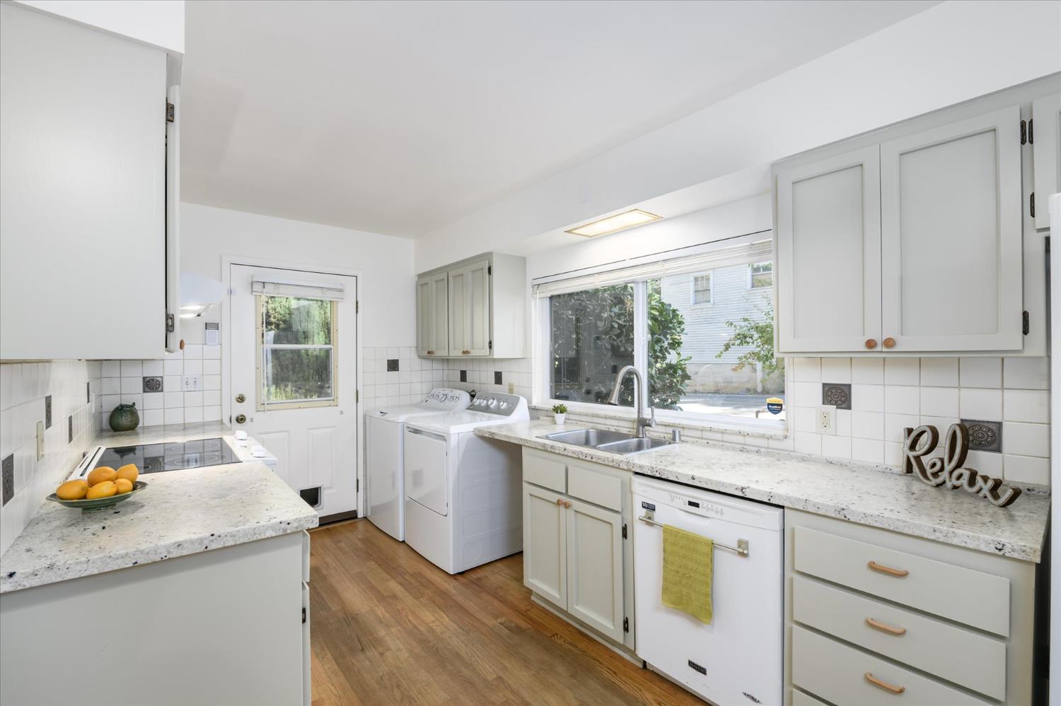 3166 Cedar Ravine Road Placerville, CA 95667 - Photo 7 of 29 a kitchen with a sink window and cabinets