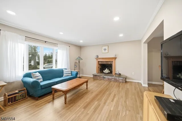 a kitchen with stainless steel appliances a refrigerator a sink a stove and cabinets