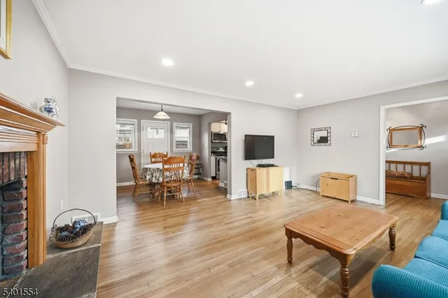 a bedroom with a bed furniture and a flat screen tv
