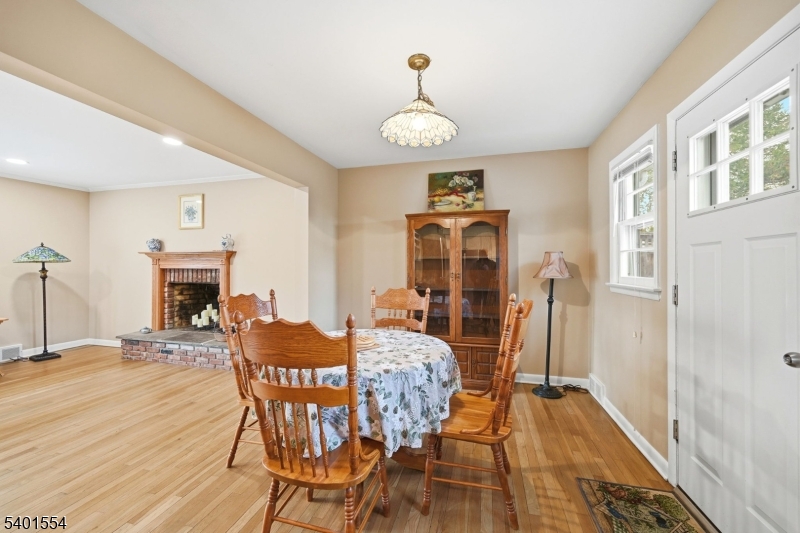 58 Dogwood Road Morristown, NJ 07960 - Photo 20 of 44 a view of a dining room with furniture wooden floor and a chandelier