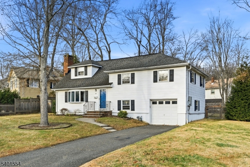 58 Dogwood Road Morristown, NJ 07960 - Photo 2 of 44 a front view of a house with a yard covered in snow