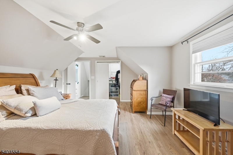 58 Dogwood Road Morristown, NJ 07960 - Photo 29 of 44 a bedroom with a bed furniture and a flat screen tv