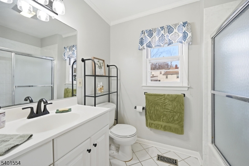 58 Dogwood Road Morristown, NJ 07960 - Photo 32 of 44 a bathroom with a sink a toilet and shower