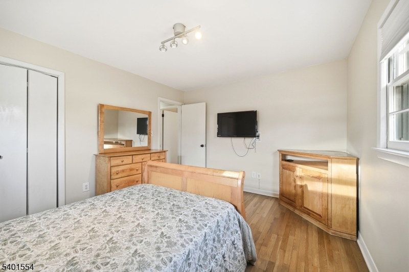 58 Dogwood Road Morristown, NJ 07960 - Photo 34 of 44 a bedroom with a bed and a flat screen tv