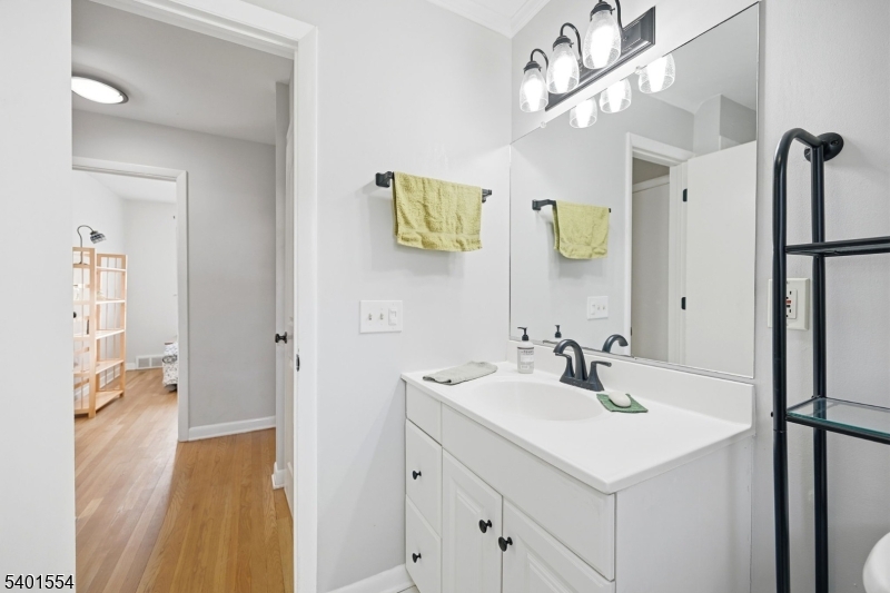 58 Dogwood Road Morristown, NJ 07960 - Photo 39 of 44 a bathroom with a sink and a mirror