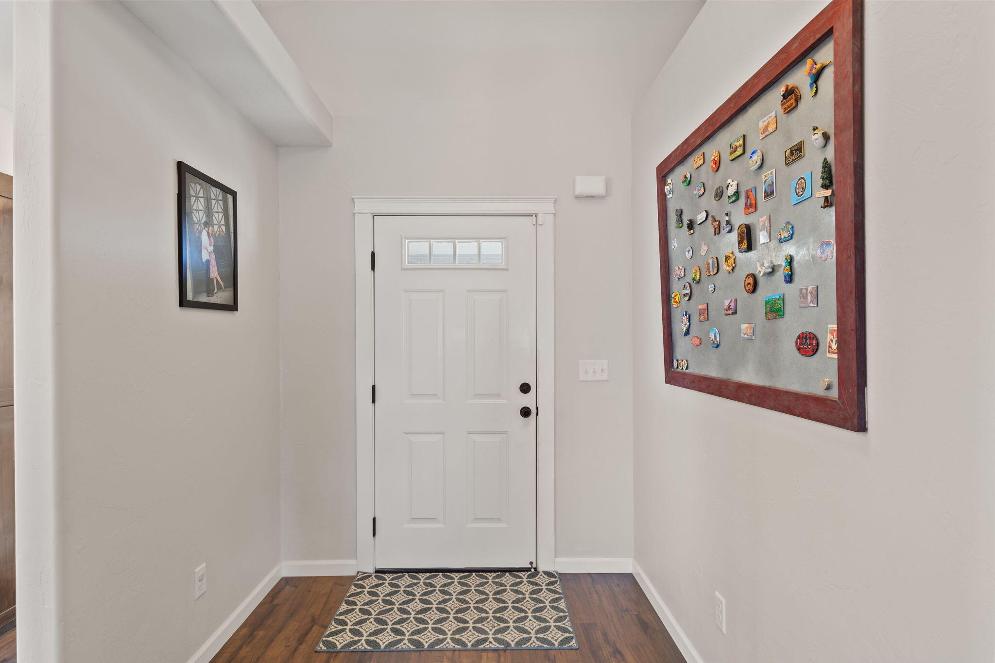 110 Linton Way Eagle Point, OR 97524 - Photo 5 of 41 a view of a hallway with a painting on the wall