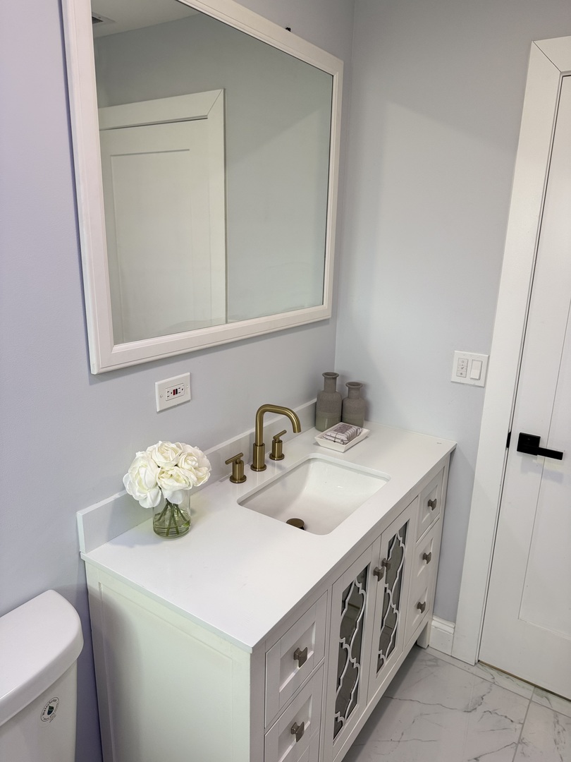 7015 Palma Lane Morton Grove, IL 60053 - Photo 11 of 19 a bathroom with a sink and a toilet