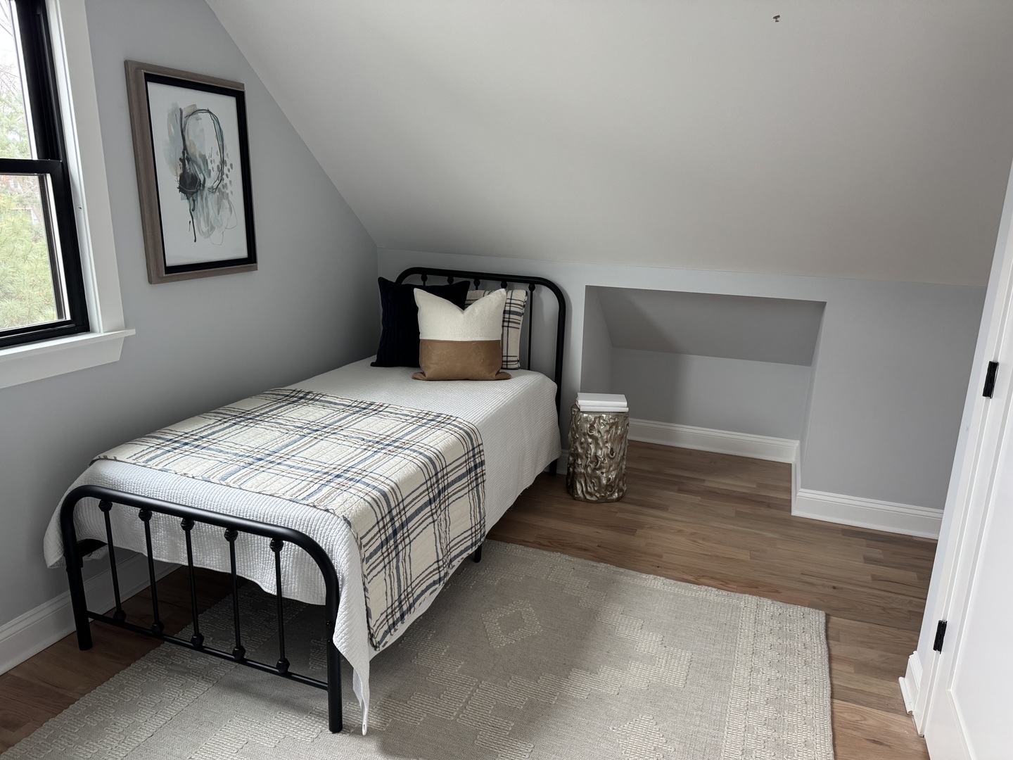 7015 Palma Lane Morton Grove, IL 60053 - Photo 14 of 19 a bedroom with a bed paintings on the wall and a window