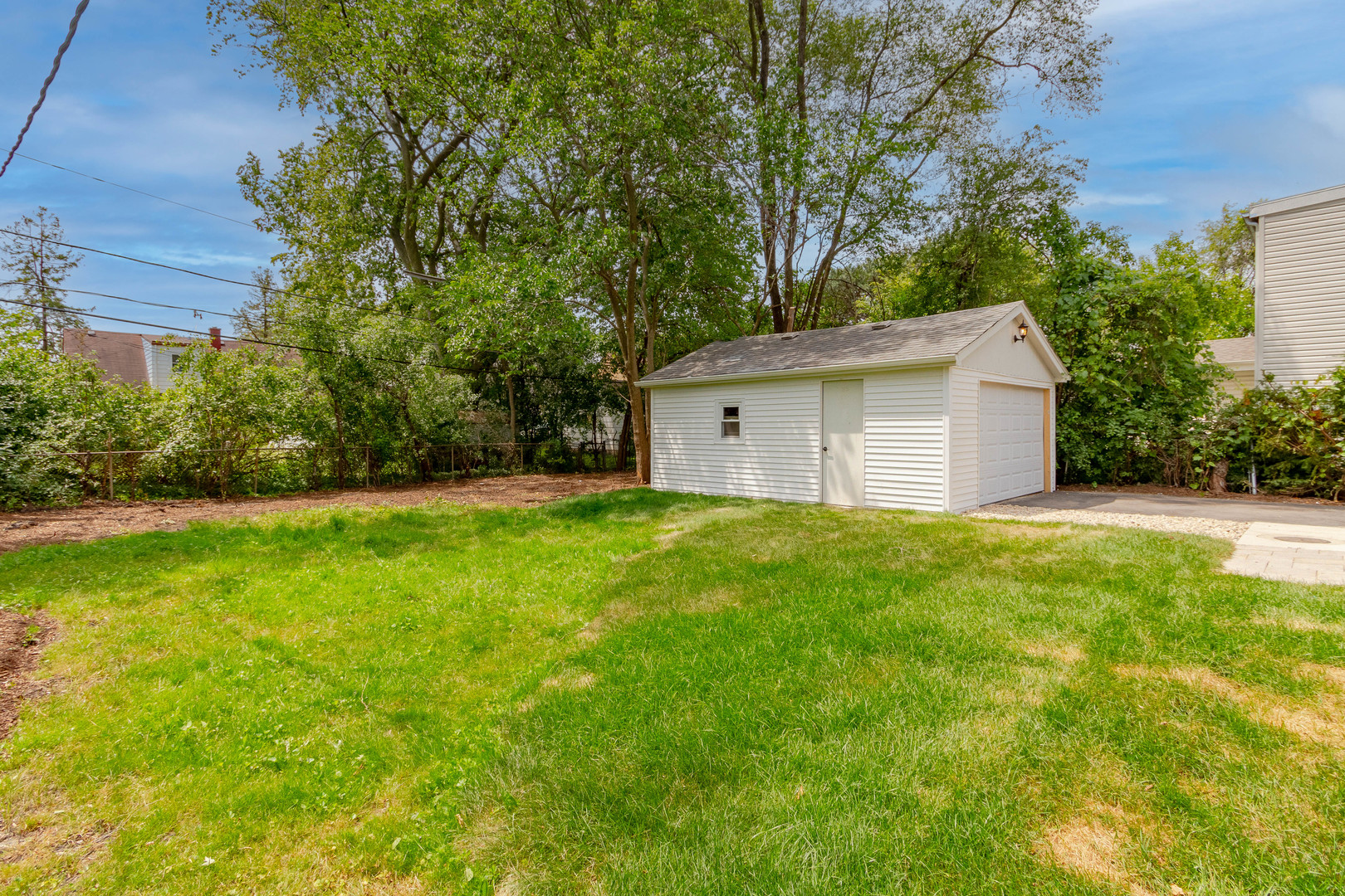 7015 Palma Lane Morton Grove, IL 60053 - Photo 4 of 19 a view of a backyard with a garden