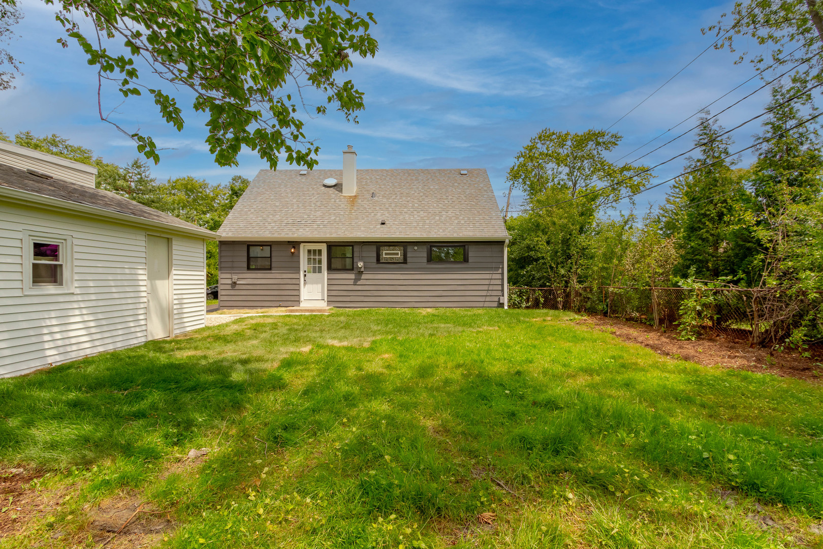 7015 Palma Lane Morton Grove, IL 60053 - Photo 5 of 19 a front view of a house with a yard