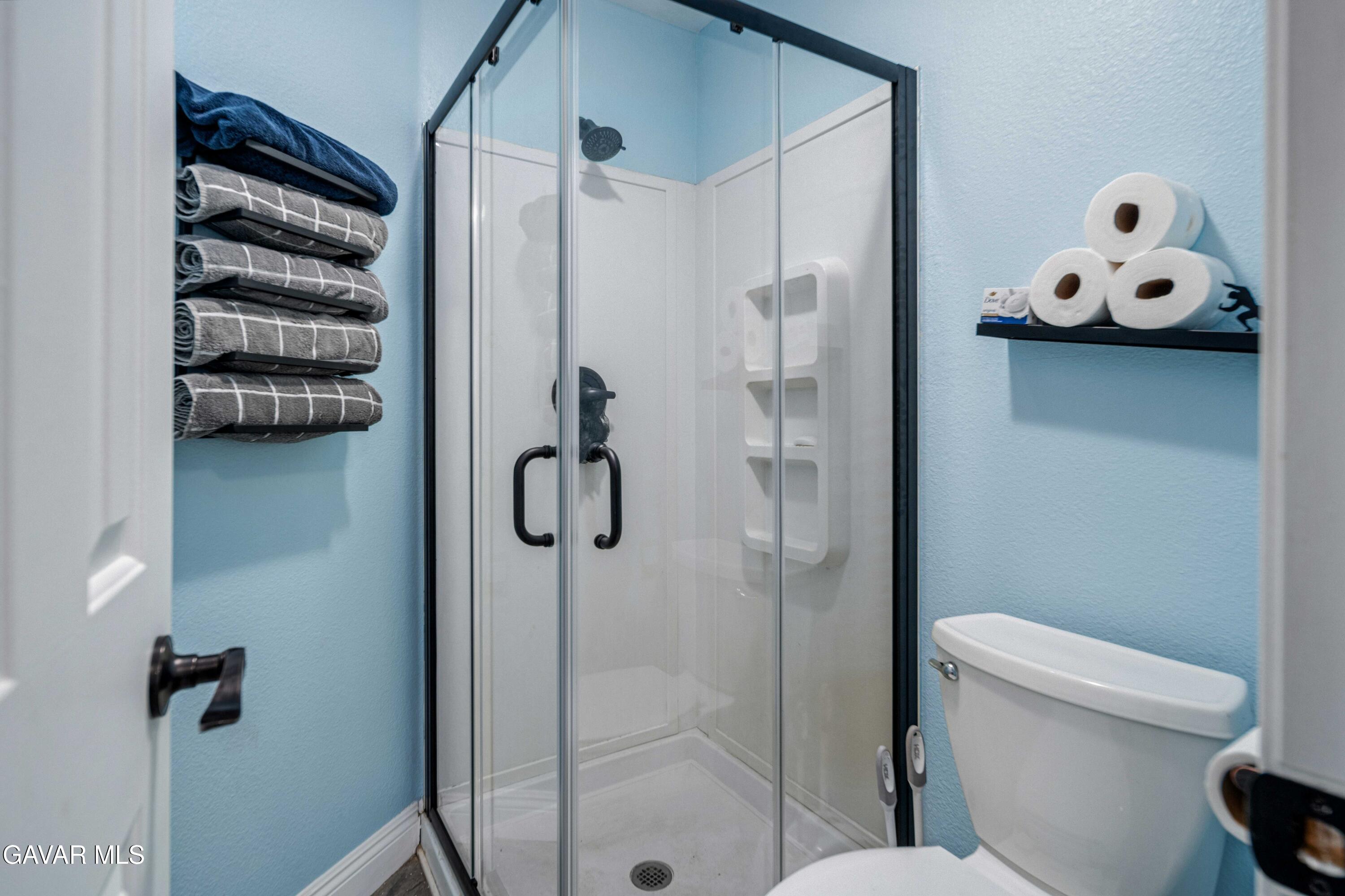 23800 Bertram Circle Tehachapi, CA 93561 - Photo 27 of 85 a bathroom with a toilet sink and shower