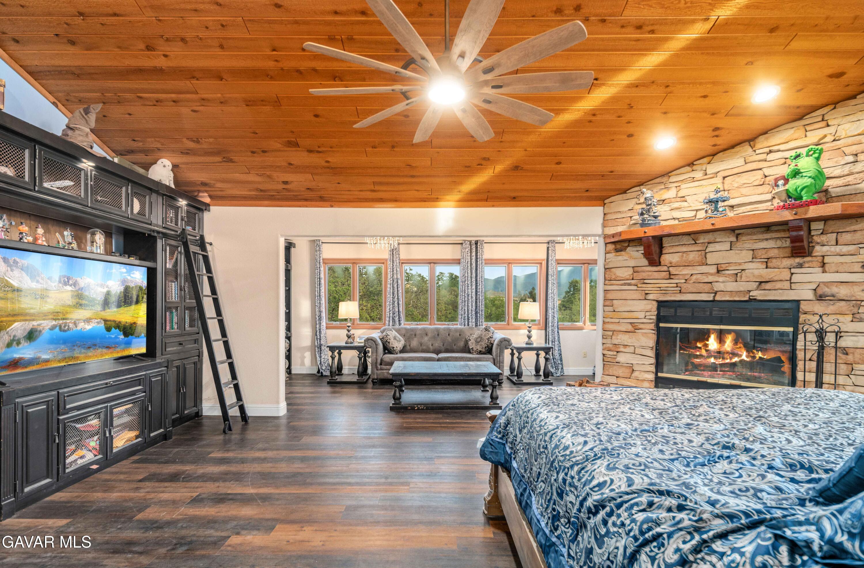 23800 Bertram Circle Tehachapi, CA 93561 - Photo 39 of 85 a living room with furniture and a flat screen tv