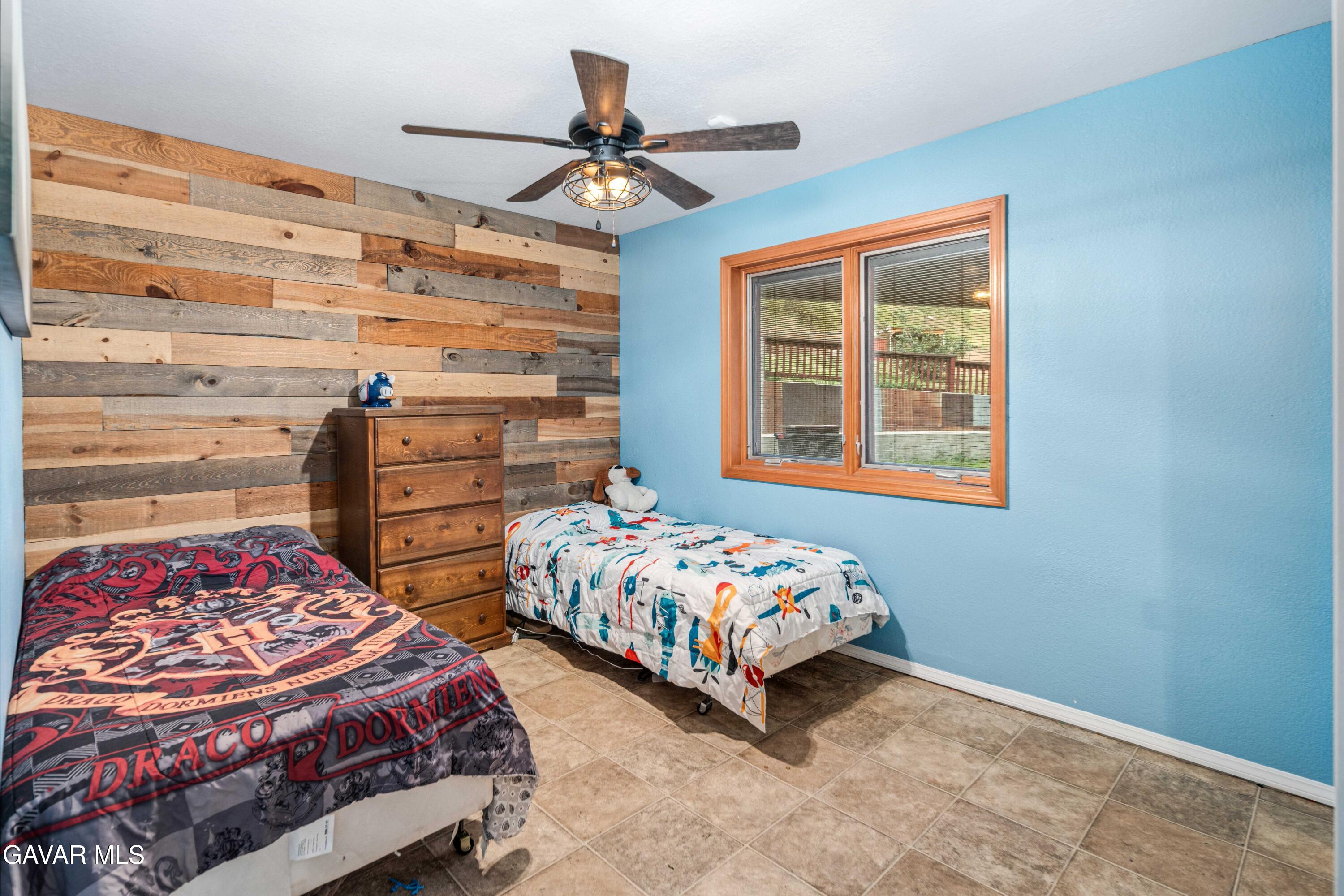 23800 Bertram Circle Tehachapi, CA 93561 - Photo 55 of 85 a bedroom with two beds and a window