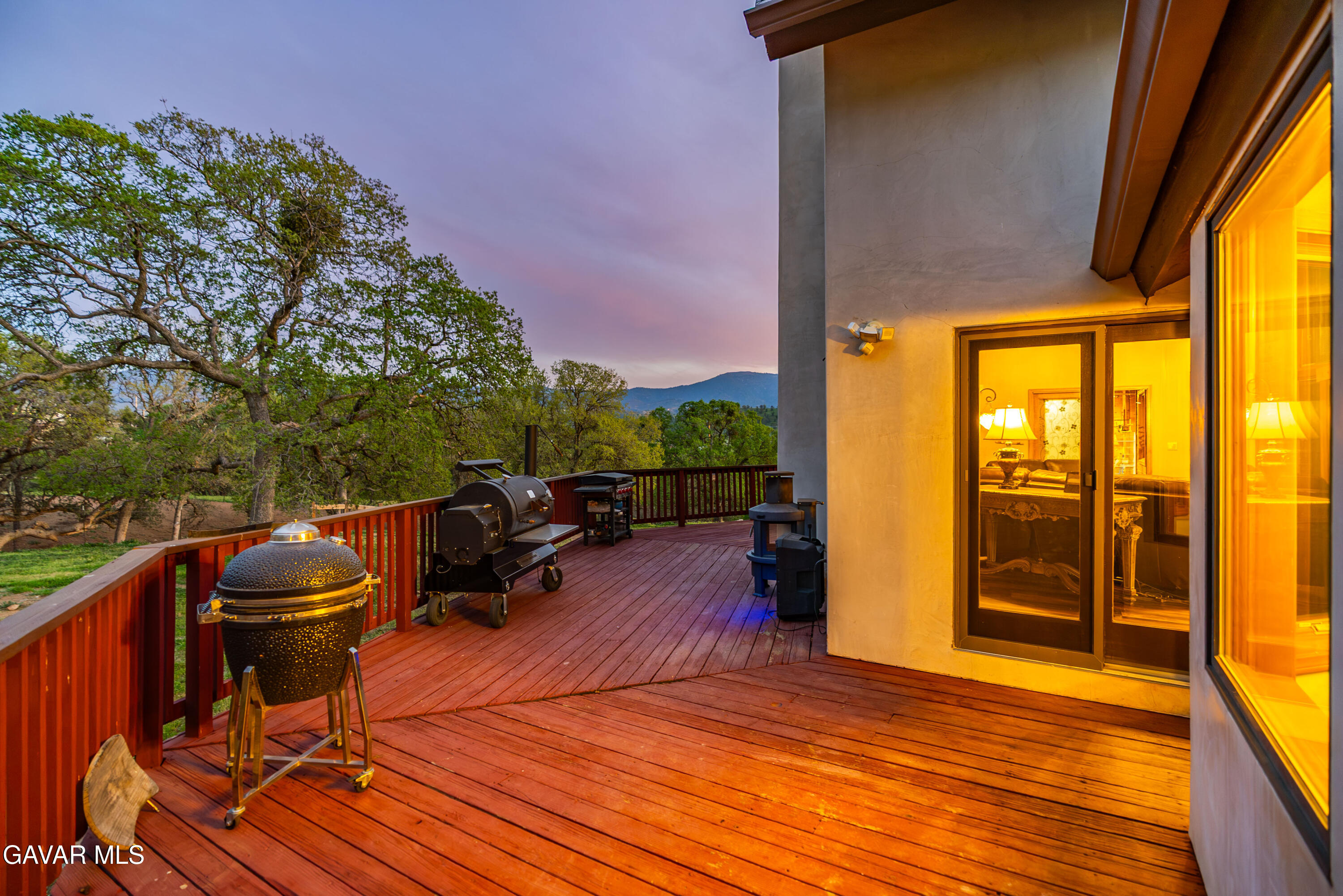 23800 Bertram Circle Tehachapi, CA 93561 - Photo 60 of 85 a backyard of a house with barbeque oven table and chairs
