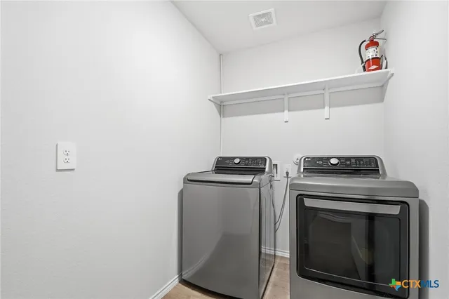 a stove top oven sitting inside of a kitchen
