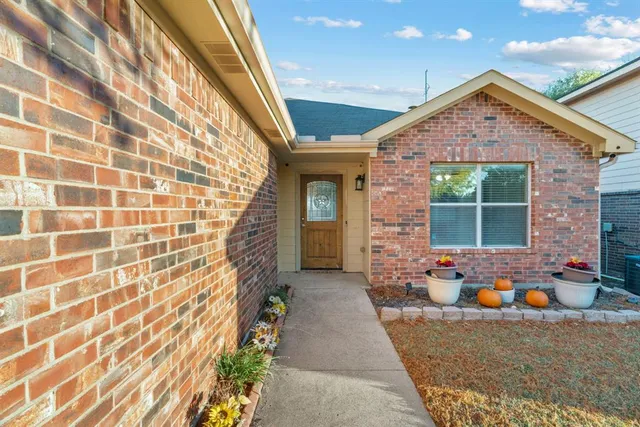 a front view of a house with outdoor space