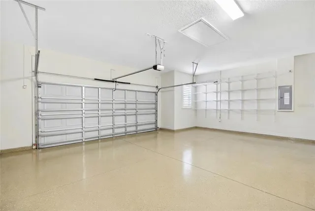 a hallway with wooden floor and furniture
