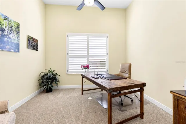 a very nice looking room with wooden floor and a large window