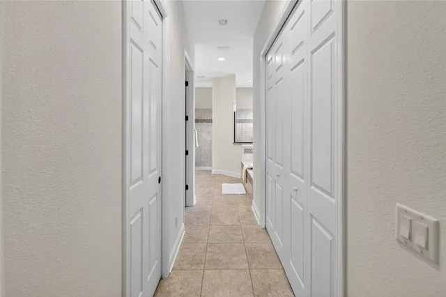 a bathroom with a granite countertop sink and mirror