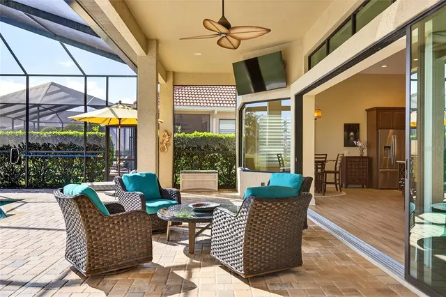 a view of a patio with a dining table and chairs