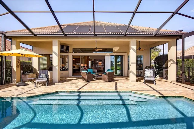 a view of a backyard with sitting area