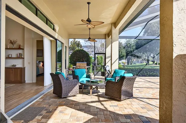 a view of a backyard with swimming pool