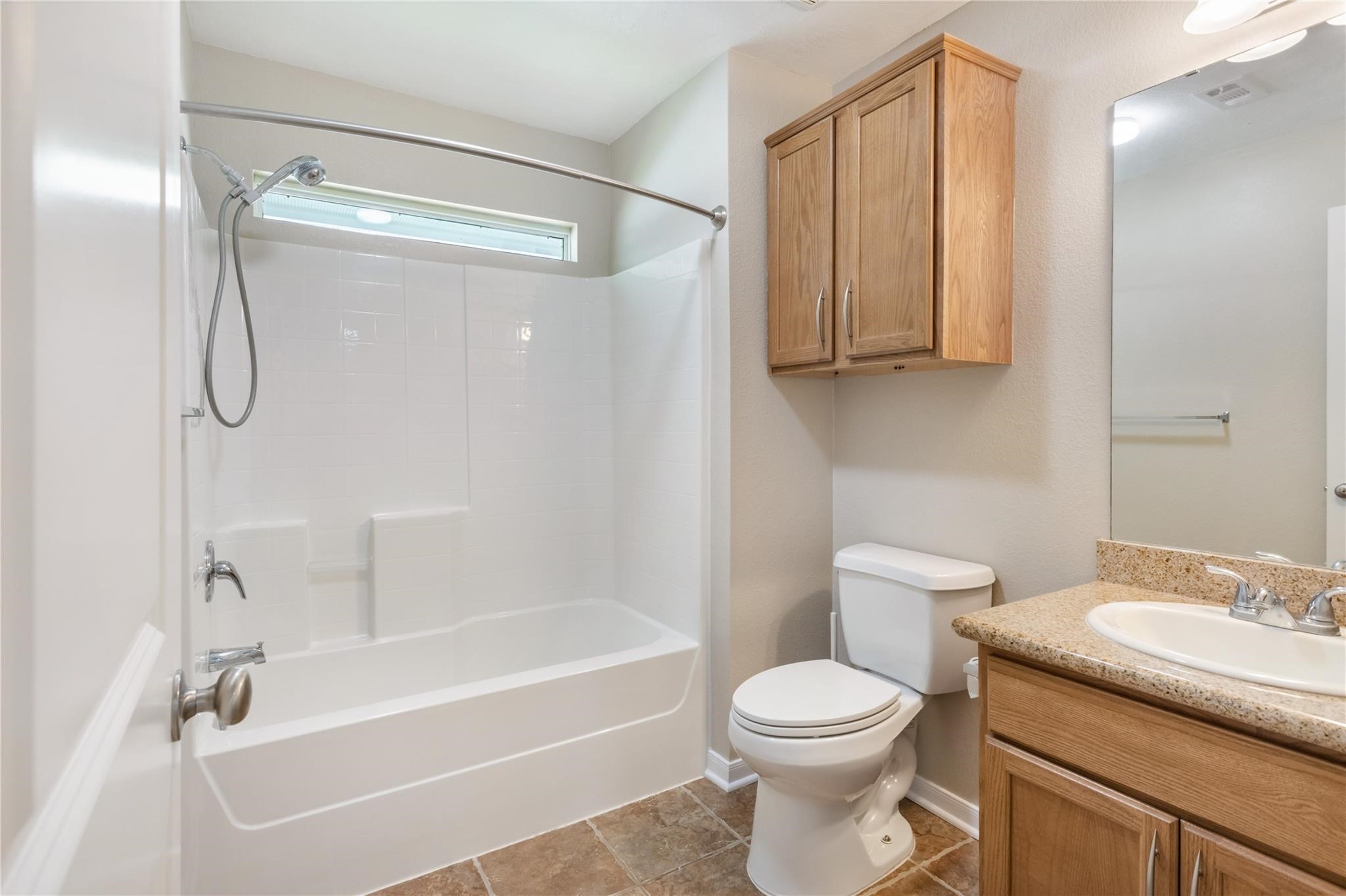 2023 Mountain Wind Loop Bryan, TX 77807 - Photo 15 of 16 a bathroom with a toilet sink and shower