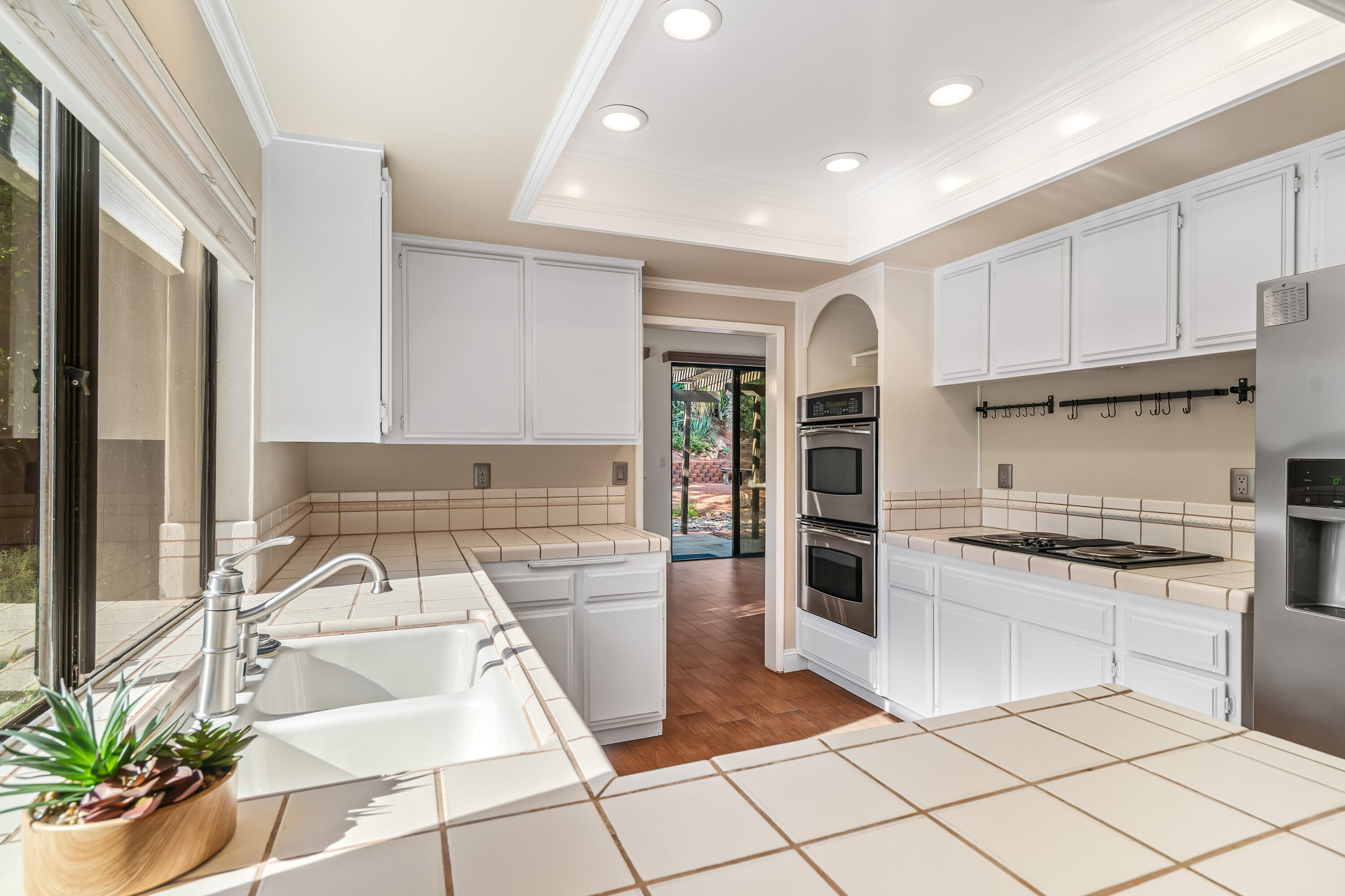 37 Santo Domingo Drive Rancho Mirage, CA 92270 - Photo 18 of 49 a kitchen with stainless steel appliances granite countertop a stove a sink and a refrigerator