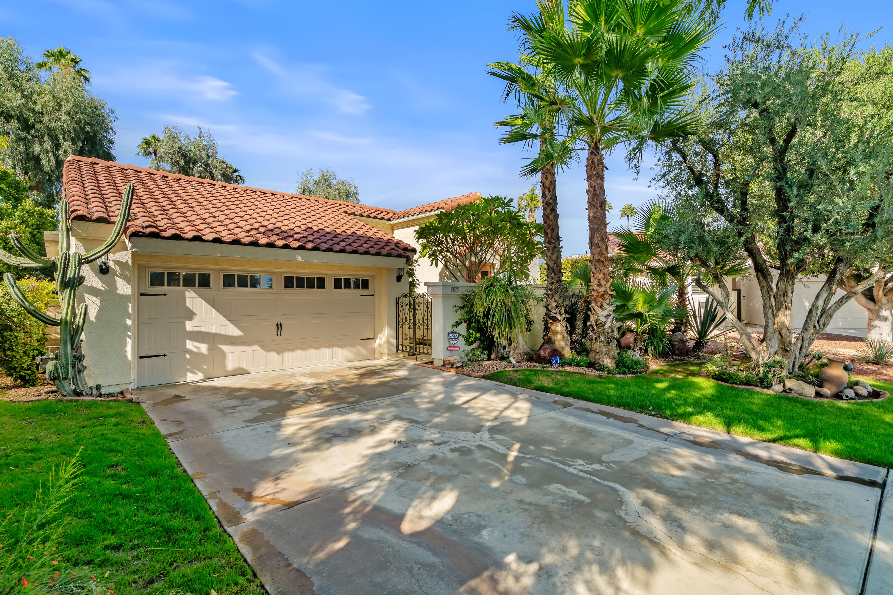 37 Santo Domingo Drive Rancho Mirage, CA 92270 - Photo 2 of 49 a front view of a house with garden