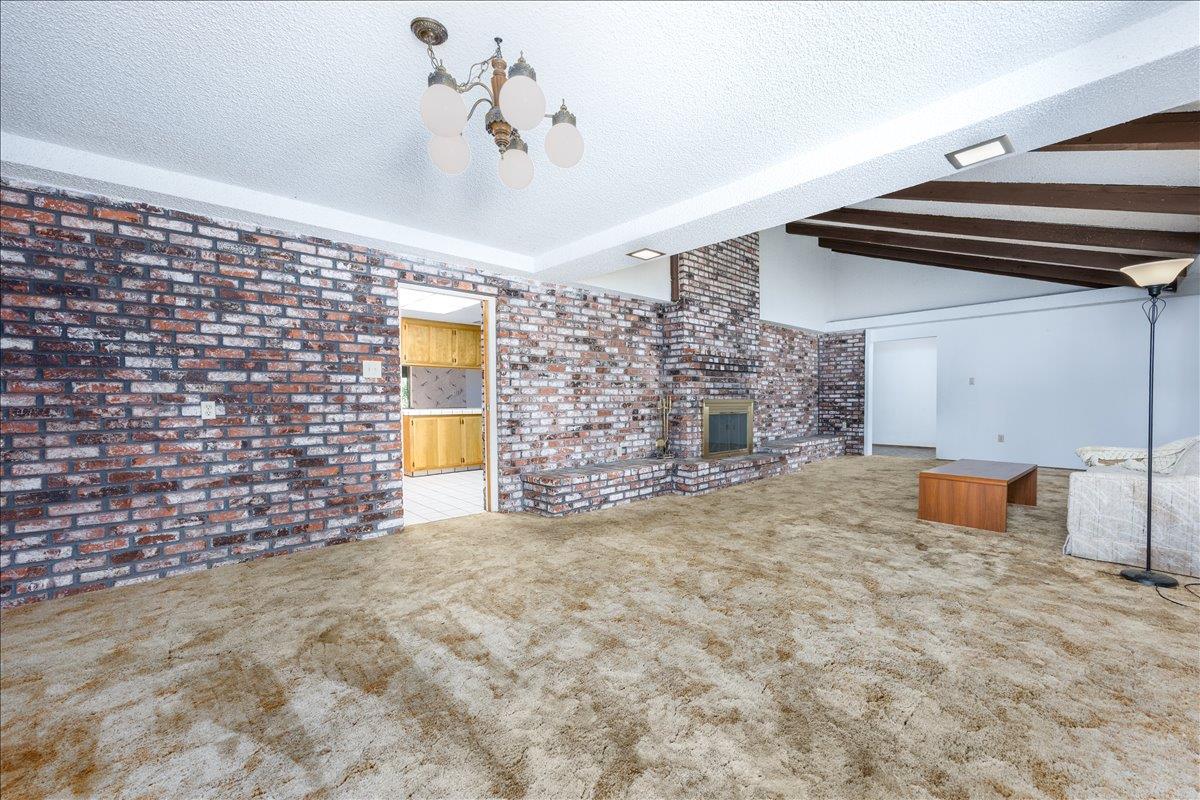 12188 Clay Station Road Herald, CA 95638 - Photo 56 of 89 Dining area off kitchen and view into vaulted ceiling fireplace living room