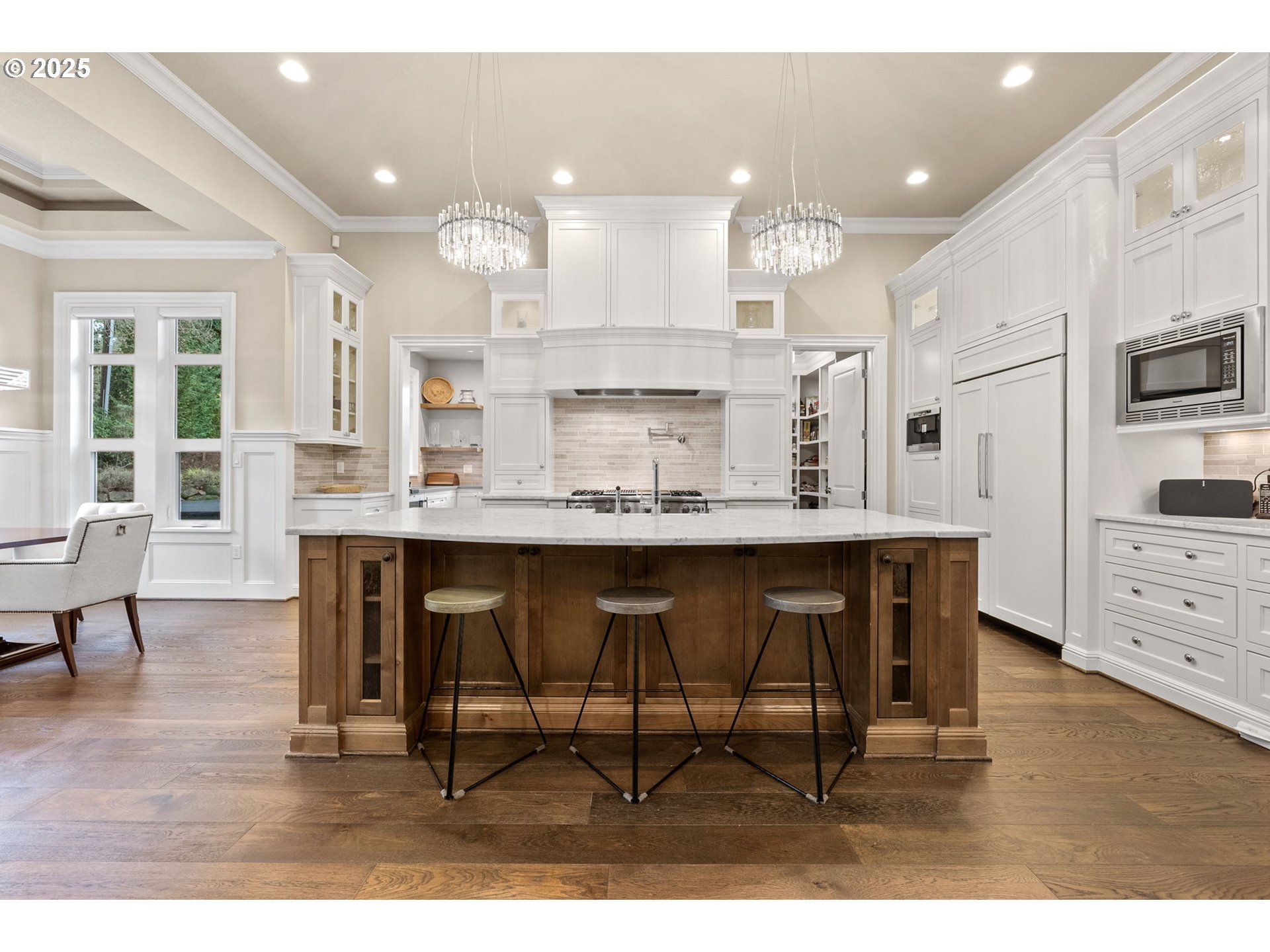13710 Knaus Road Lake Oswego, OR 97034 - Photo 13 of 47 a kitchen with kitchen island granite countertop a table chairs sink and cabinets