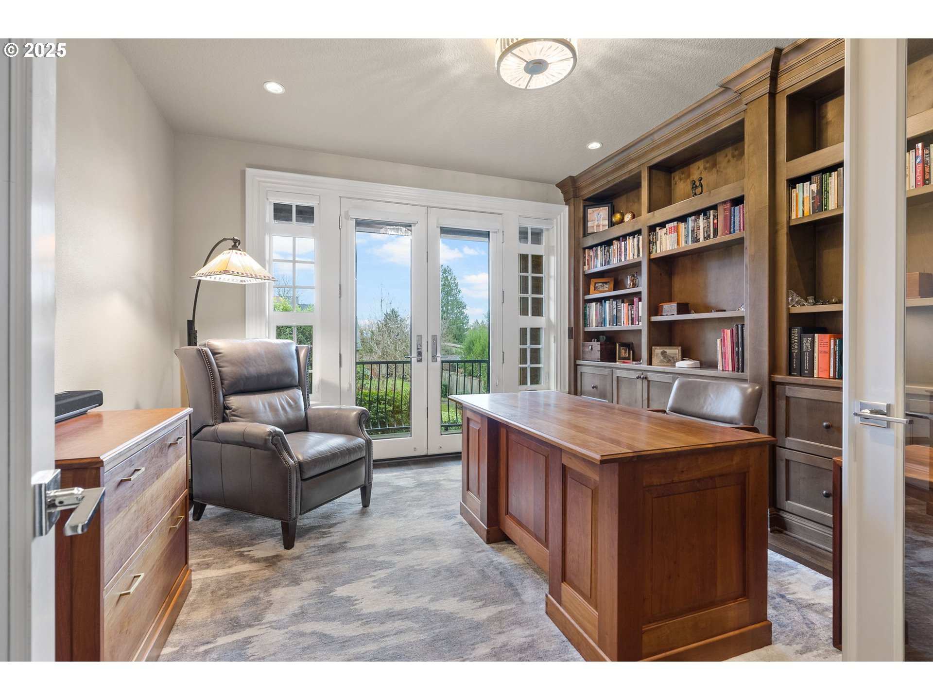 13710 Knaus Road Lake Oswego, OR 97034 - Photo 29 of 47 a living room with furniture and a bookshelf