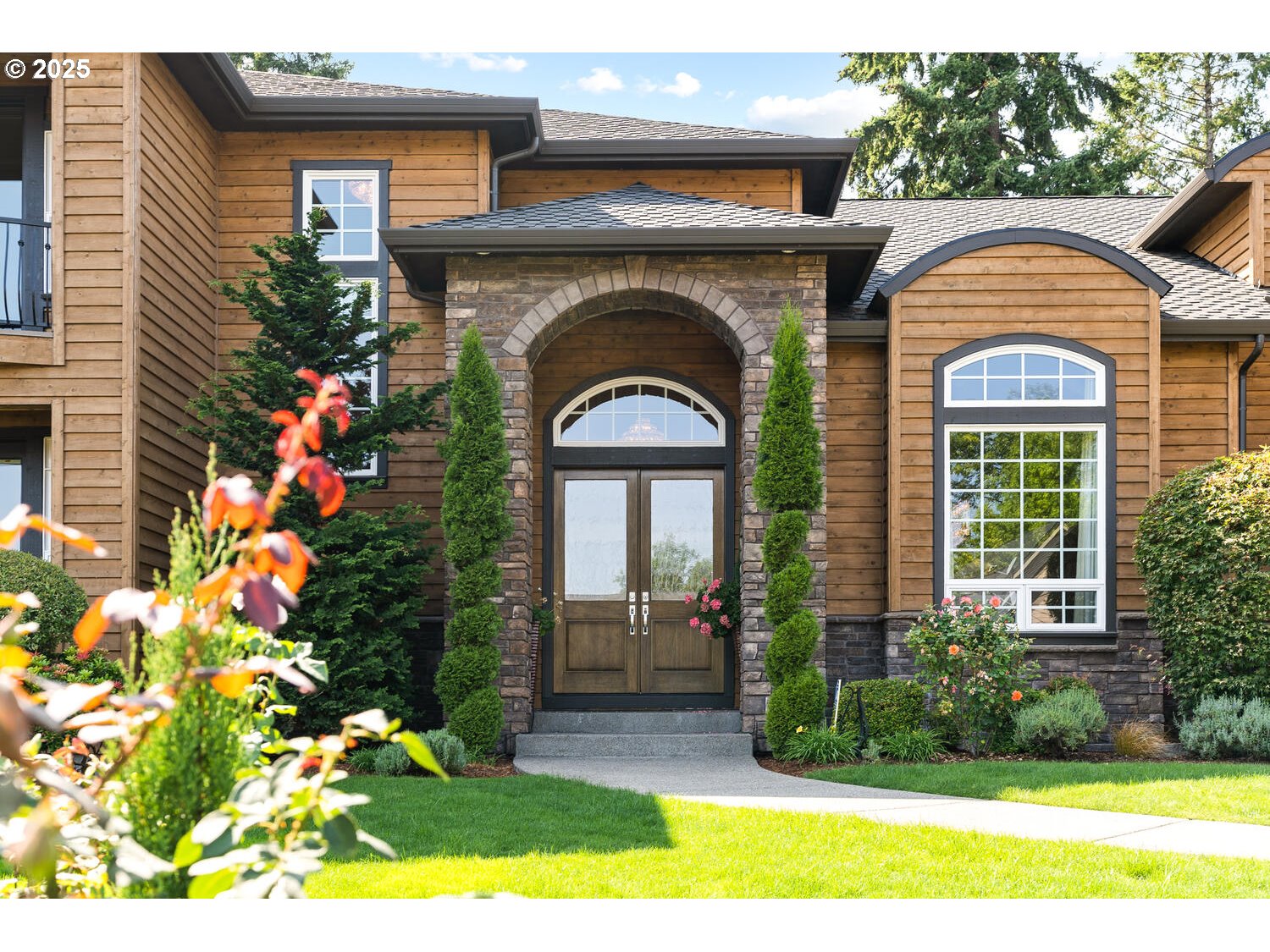 13710 Knaus Road Lake Oswego, OR 97034 - Photo 4 of 47 a front view of a house with garden