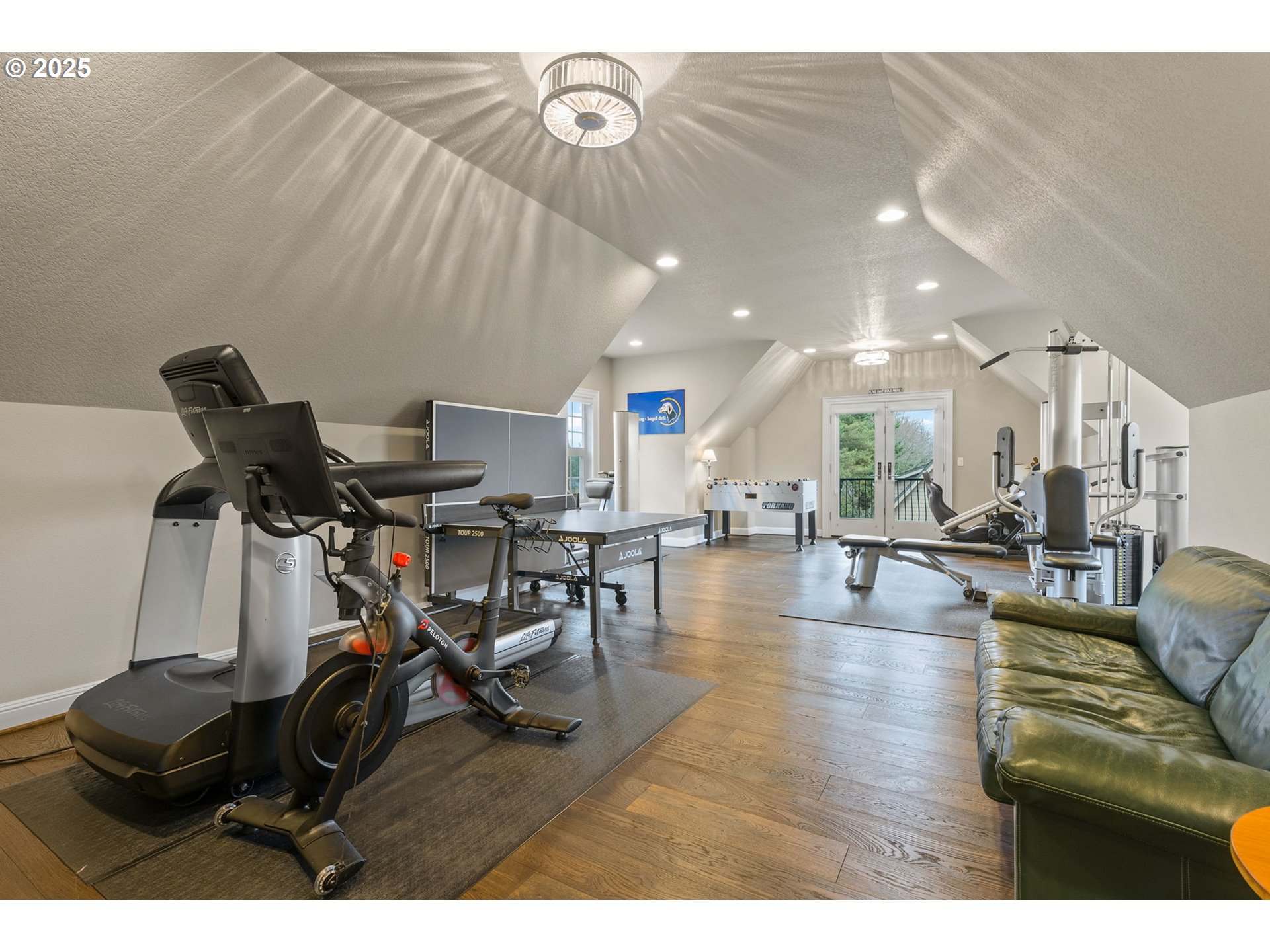 13710 Knaus Road Lake Oswego, OR 97034 - Photo 42 of 47 a view of a livingroom with furniture and a flat screen tv