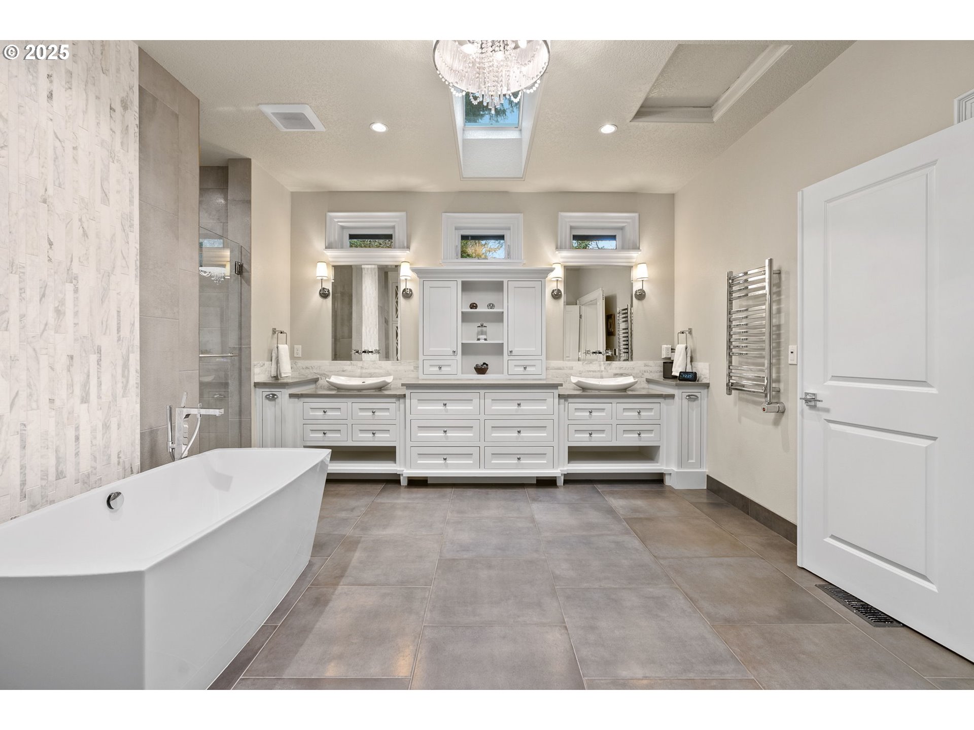 13710 Knaus Road Lake Oswego, OR 97034 - Photo 8 of 47 a bathroom with a tub a double vanity sink and mirror