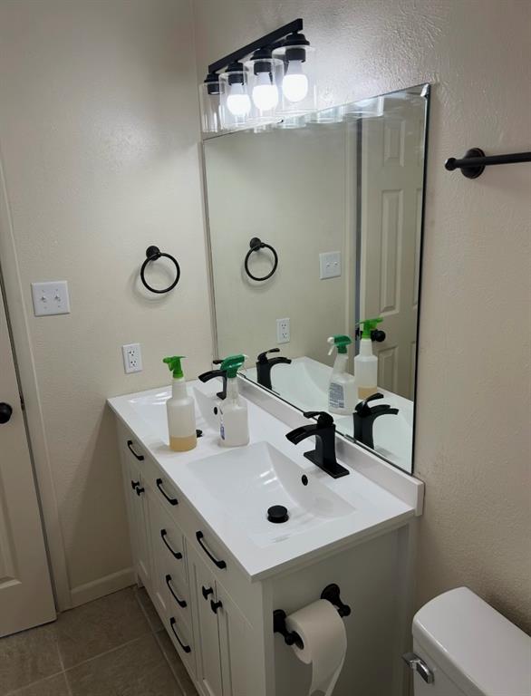 208 Lakeview Lane Temple, TX 76502 - Photo 14 of 18 Primary bathroom with new double servevanity and fresh coat of paint