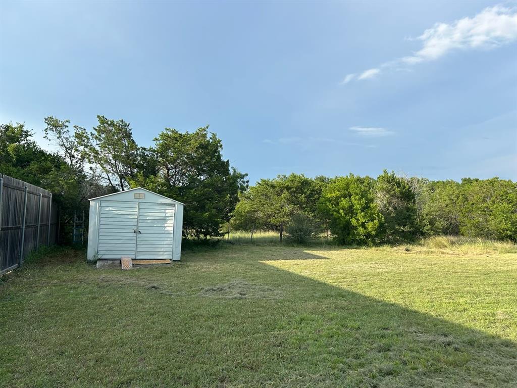 208 Lakeview Lane Temple, TX 76502 - Photo 4 of 18 View of yard featuring a storage unit