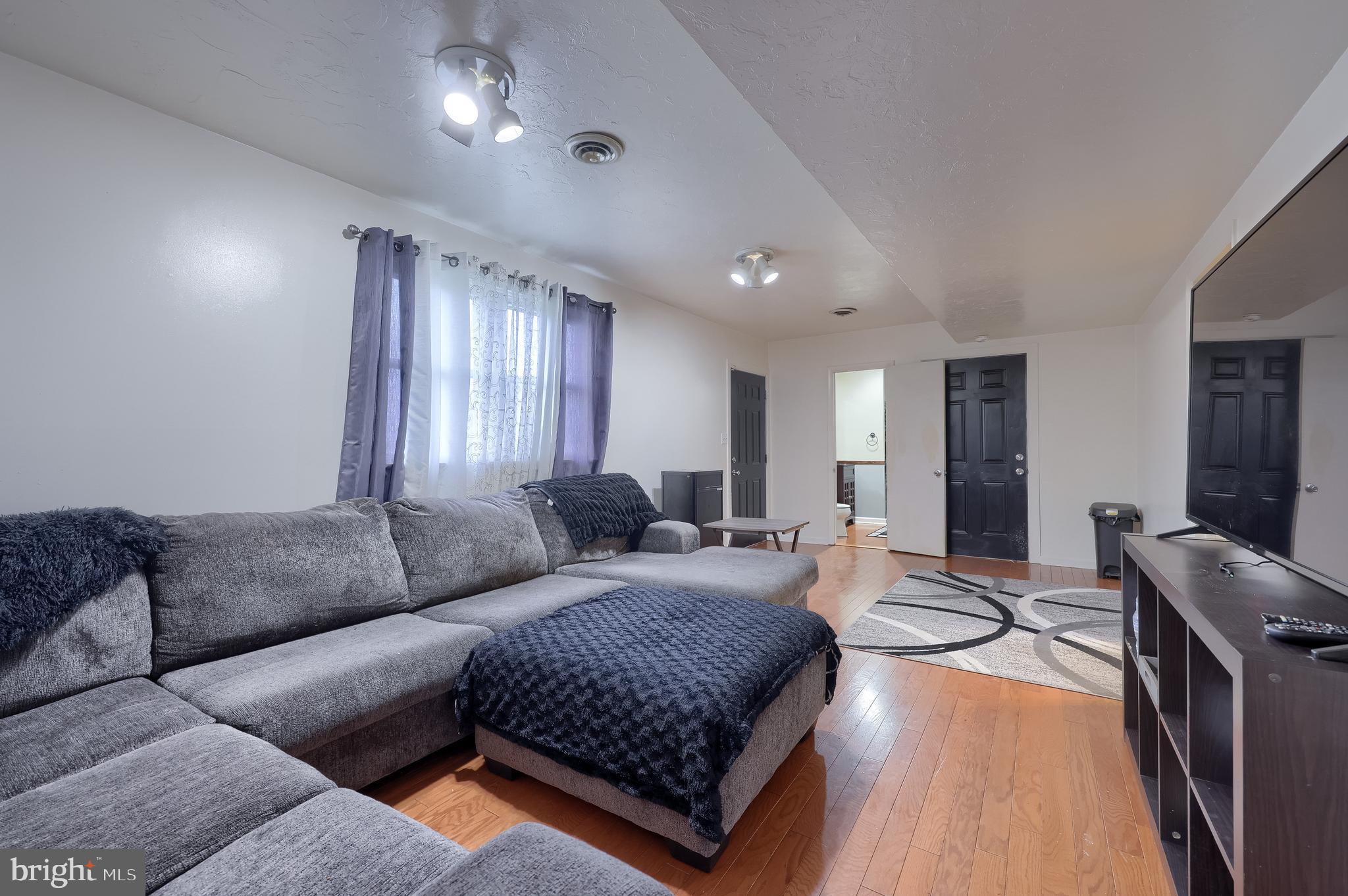 4131 Davidsburg Road Dover, PA 17315 - Photo 12 of 38 a living room with furniture and a couch