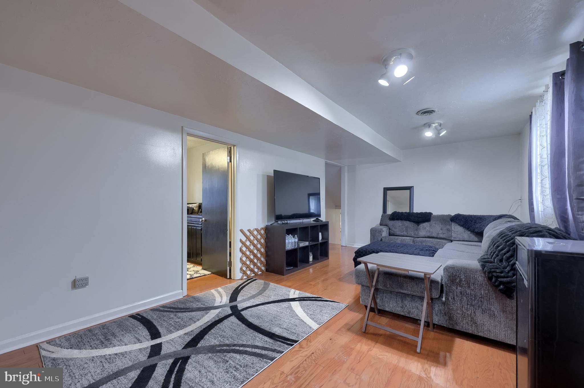 4131 Davidsburg Road Dover, PA 17315 - Photo 15 of 38 a living room with furniture and a flat screen tv