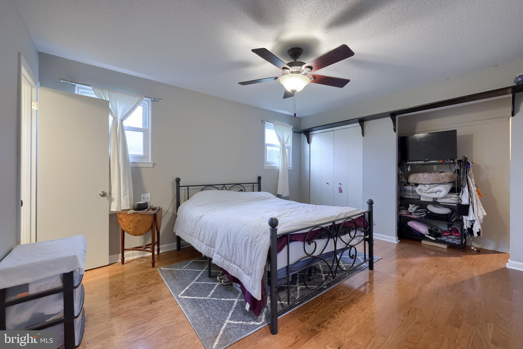 4131 Davidsburg Road Dover, PA 17315 - Photo 25 of 38 a spacious bedroom with a bed and a chandelier
