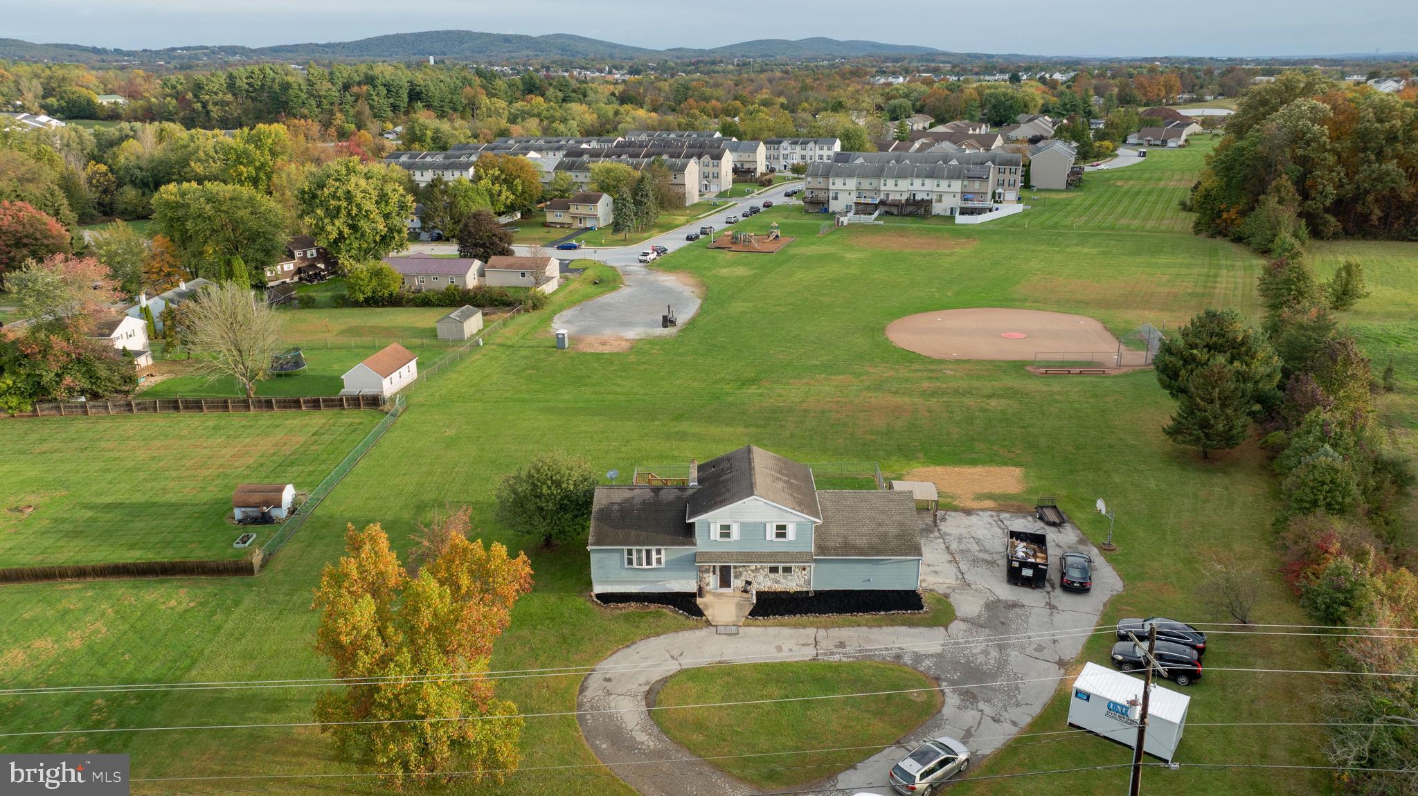 4131 Davidsburg Road Dover, PA 17315 - Photo 33 of 38 an aerial view of a house with a garden and lake view