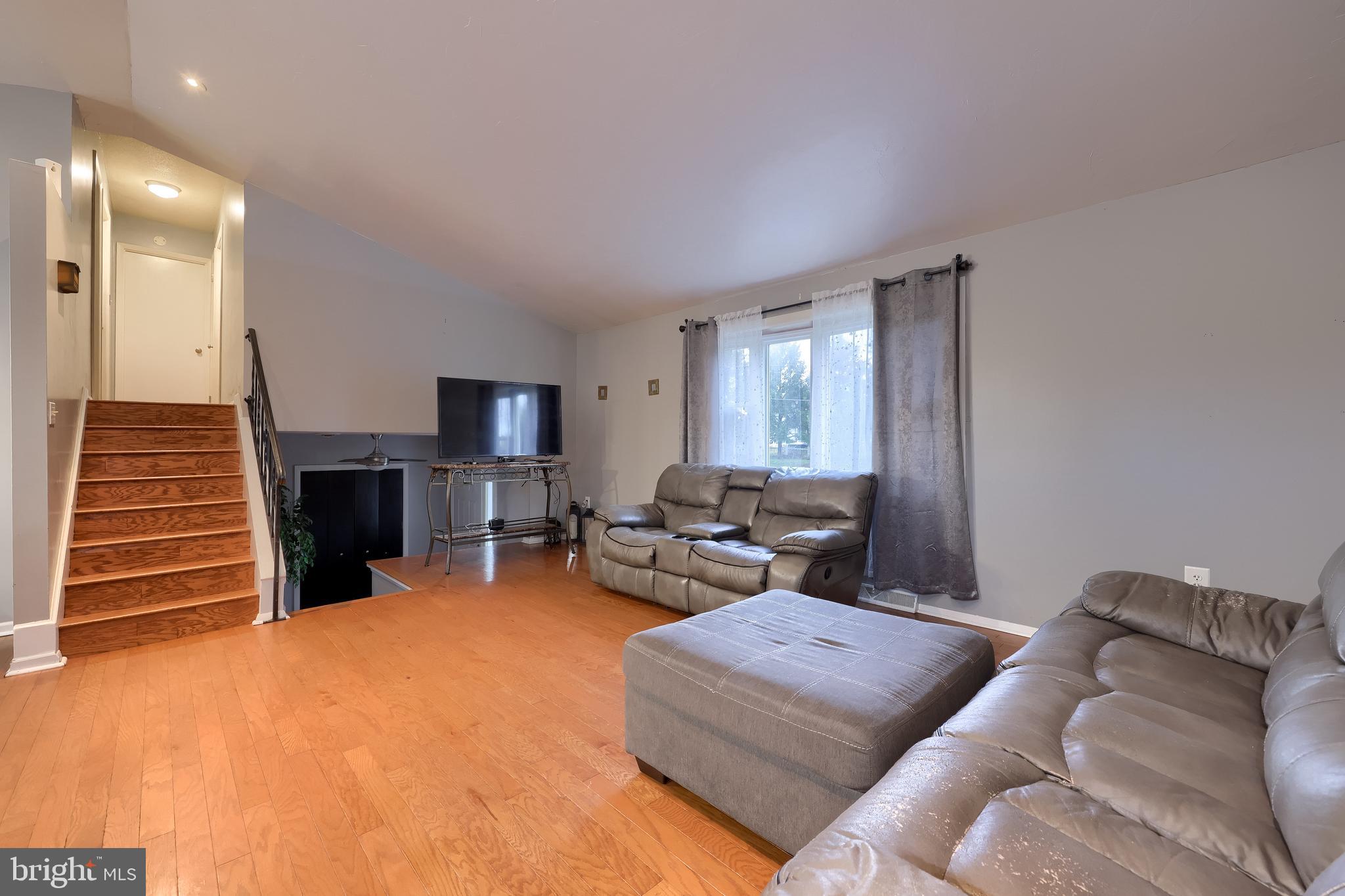 4131 Davidsburg Road Dover, PA 17315 - Photo 5 of 38 a living room with furniture and a fireplace