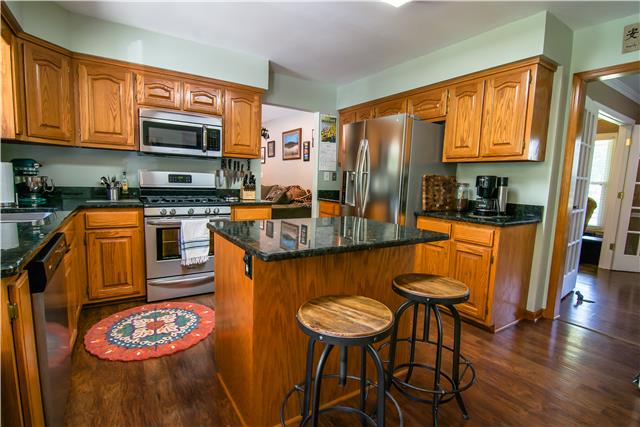 2213 Wolfe Road White Bluff, TN 37187 - Photo 13 of 20 Eat-in kitchen with granite countertops and island