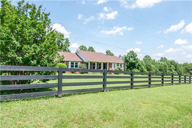 2213 Wolfe Road White Bluff, TN 37187 - Photo 2 of 20 Newly installed distinguished split rail fence that highlights the lush green front lawn.