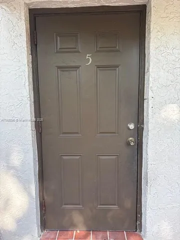a kitchen with stainless steel appliances a sink and a counter